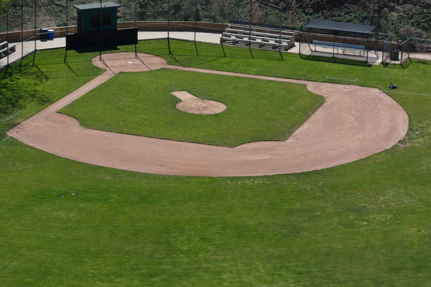 LIttle League baseball field with green grass and dirt